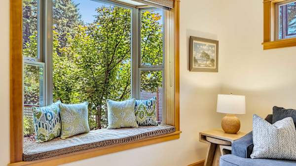 Bright coastal interiors create a welcoming space to relax after a day at the beach.