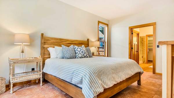 The main-level king suite provides convenience and privacy for guests.
