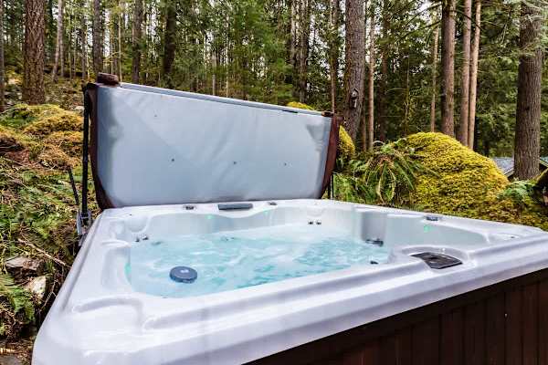 Soak in the hot tub while soaking up nature