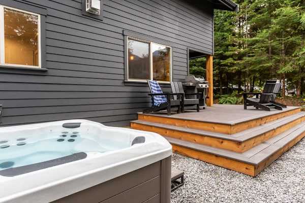8 person hot tub conveniently located off the back deck. 