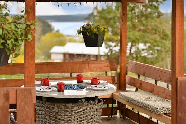 Spacious covered seating space on the deck with views.