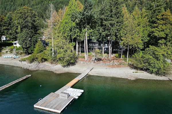 Lakeside private dock and beach.