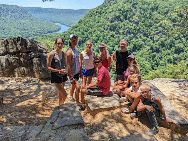 Meet the May family, who own and operate Wauhatchie Woodlands and two other Timberroot Rustic Retreats. Many of our cabins are named for members of the family. Pictured are Ani, Thomas, Sophie, Kai, Elise, Frank, Nicole,Eden, River, & Bryce