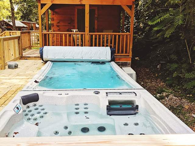 Swim spa and hot tub shared with twin cabin, River.
