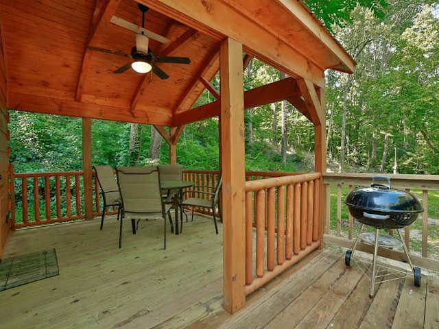 Private front deck with charcoal grill and outdoor seating