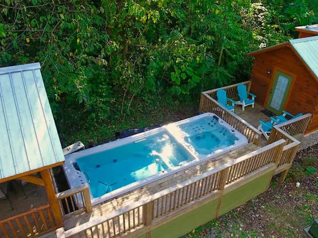 Bryce and it's neighboring cabin, River share a swim spa and hot tub.