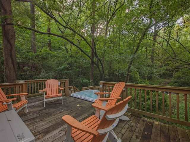 Back deck with outdoor seating and private hot tub.
