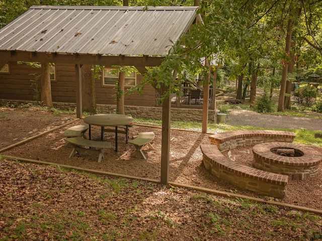 Community fire pit & picnic area between Nana & Apollonie Cabins.