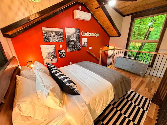 Sleeping loft with queen bed in the Wauhatchie Train Depot at Wauhatchie Woodlands in Chattanooga, TN