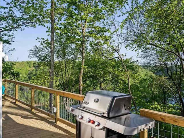 Private deck with gas grill overlooking Center Hill Lake, perfect for outdoor cooking and dining with a view.