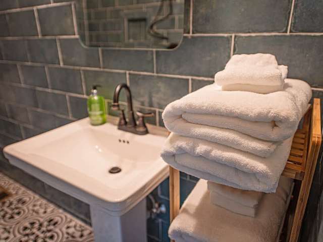 Enjoy a private bathhouse stocked with towels and our custom scented shampoo, conditioner, and body wash.