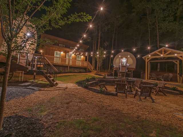 Our 3 Glamping Wagons are corralled around a community fire pit.