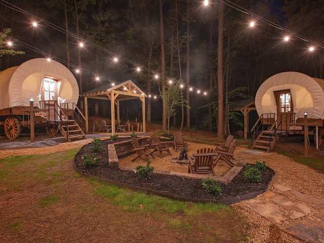 Our 3 Glamping Wagons are corralled around a community fire pit.