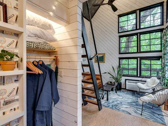 Slide open the bookshelf to revile storage and cozy robes!