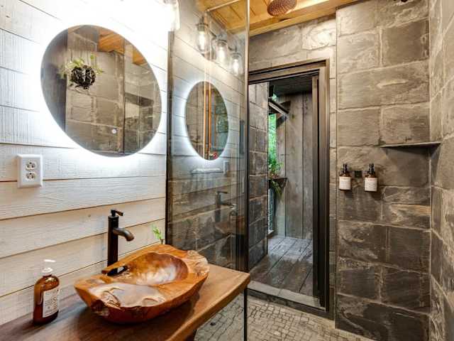 Beautiful bathroom with indoor shower and access to the outdoor shower.