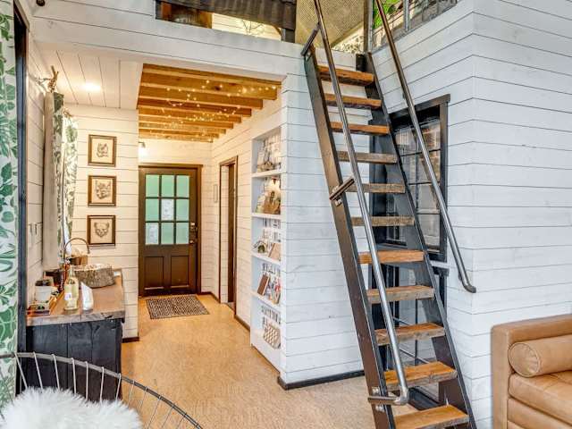 Interior view from the living room looking to the loft and the front entrance.