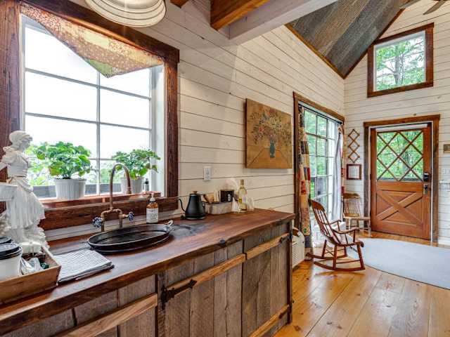 The kitchenette with custom counters and hammered copper sink