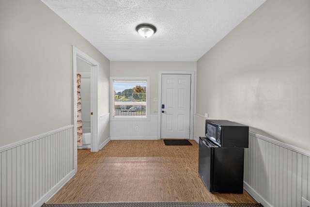 Entrance to your unit with a mini fridge and microwave