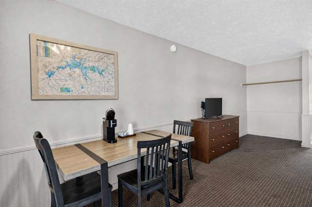 Coffee maker, TV, dresser, & table with chairs