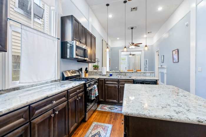 Michou's Marigny Historic Gem | Historic Getaways — 1334 kitchen towards dining
