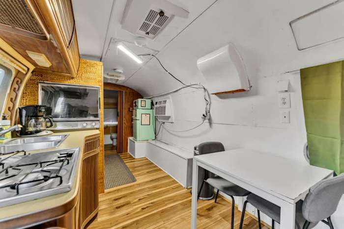 Airstream | Fire | Hammock | Hot tub — Small dining table and kitchenette