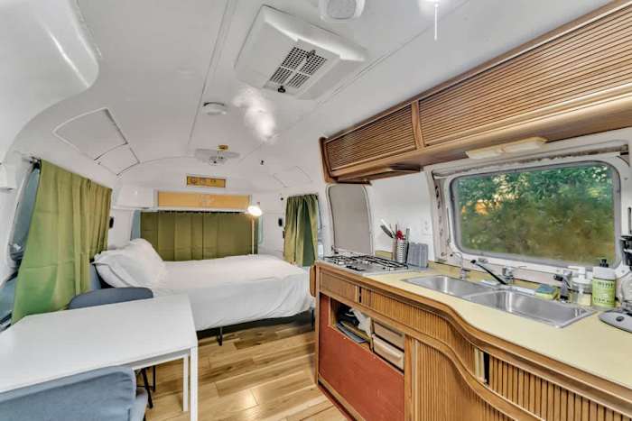 Airstream | Fire | Hammock | Hot tub — Airstream Interior with queen bed