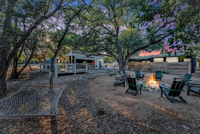 Sleeps 20+| Hot Tubs | Cowboy Pools | Projector TV — Relax under the stairs in the hammock