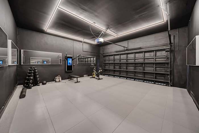 Two car garage with built in gym and Tonal