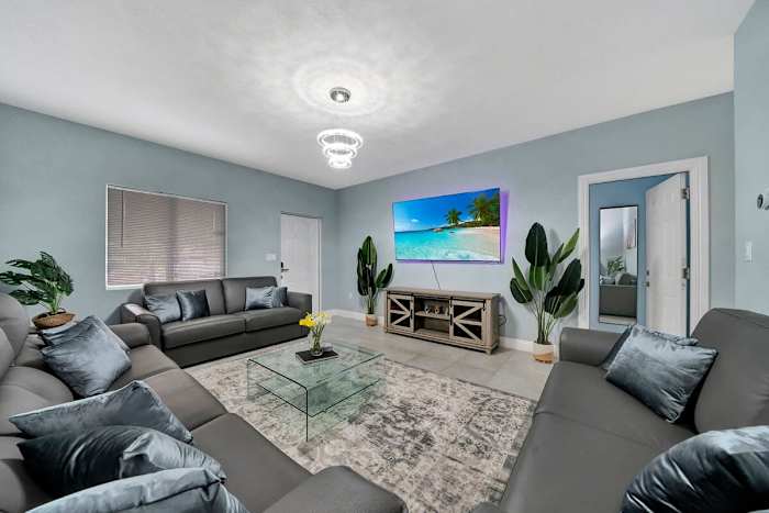 First unit living room with 70 Smart tv