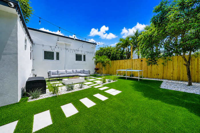 Relax in luxury with comfortable outdoor seating and a cozy fire pit.