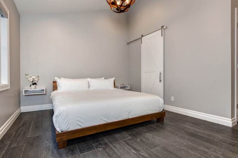 Bedroom 1 | Main Level, King Bed, Closet, TV, Full Ensuite Bathroom with Shower, His & Her's Sinks  | Abode at First Chair