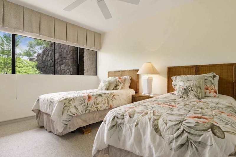 Sunlit Guest Bedroom Featuring Two Twin Beds & Large Window