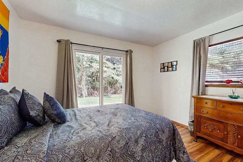 Cozy Bed with Sliding Glass Door Lawn Access