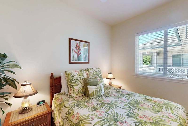 Bright Guest Bedroom with Windows & Tropical Bedding