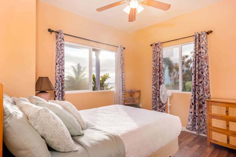 Bright Corner Bedroom With Tropical Views
