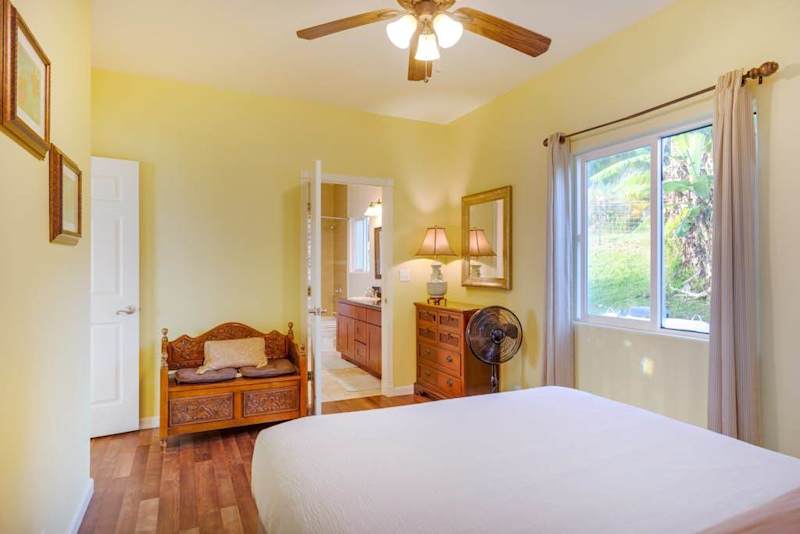 Comfortable Primary Bedroom Filled With Natural Light