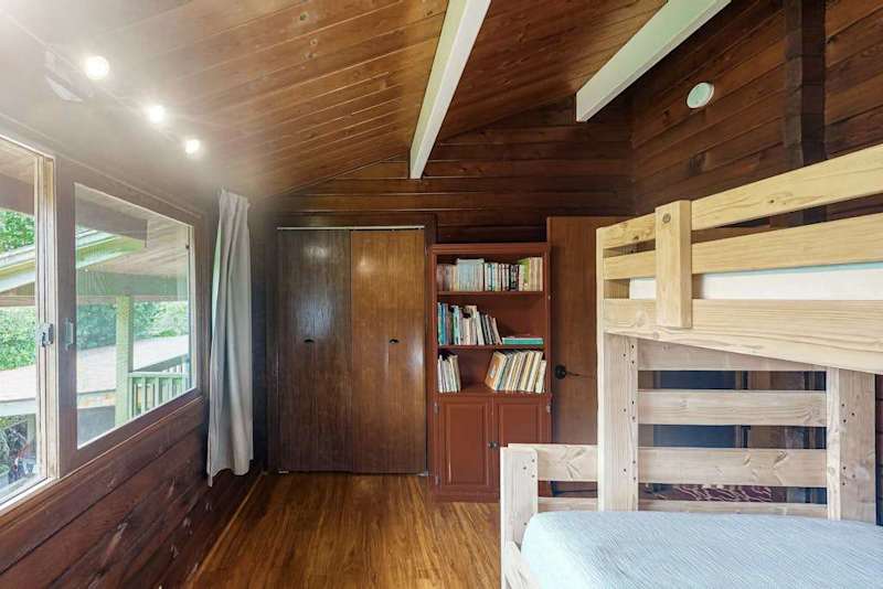 Guest room with bunk beds with a double and twin bed.