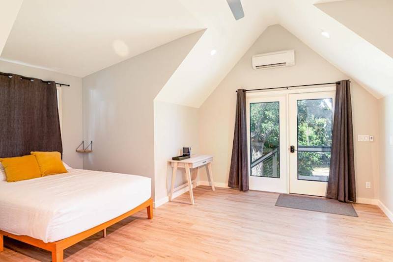 Queen Guest Suite with Private Balcony Access & Vaulted Ceilings