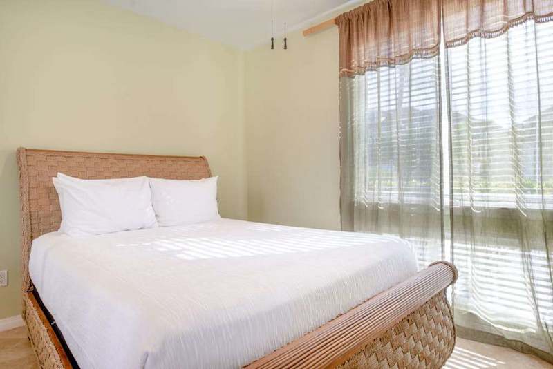 Comfortable Queen Guest Suite with Floor-to-Ceiling Windows & Sheer Curtains