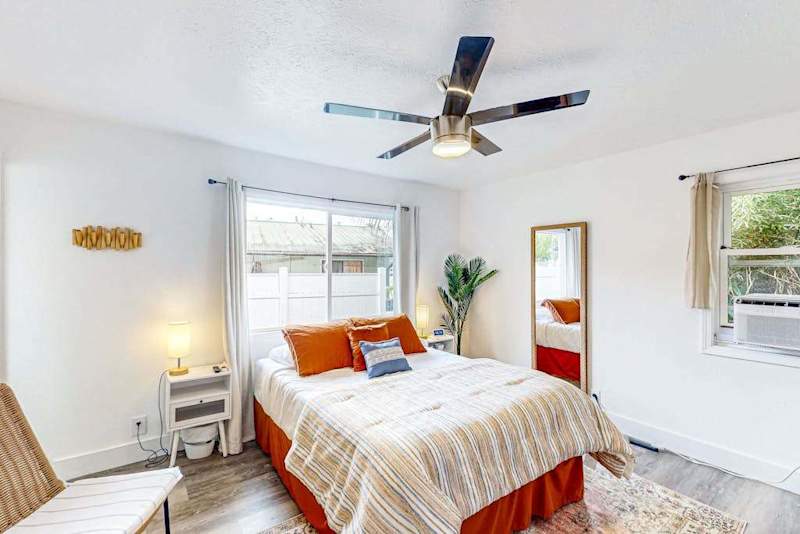 Master bedroom with queen bed and plenty of windows providing natural light.