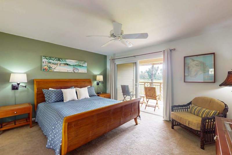 Master bedroom with king bed and private lanai access.