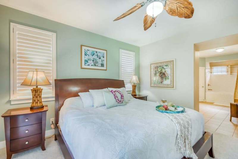 Spacious Primary Bedroom with Plush Bedding & Coastal Decor