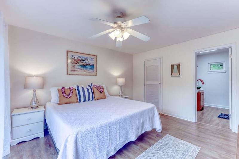 Cozy Primary Bedroom with Matching Nightstands & Ceiling Fan