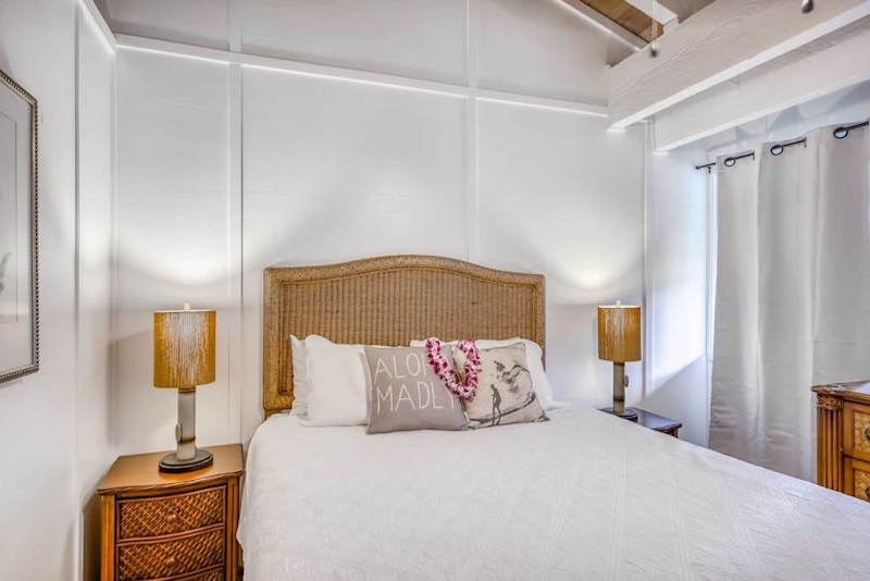 Inviting Seconday Bedroom Suite with Woven Headboard