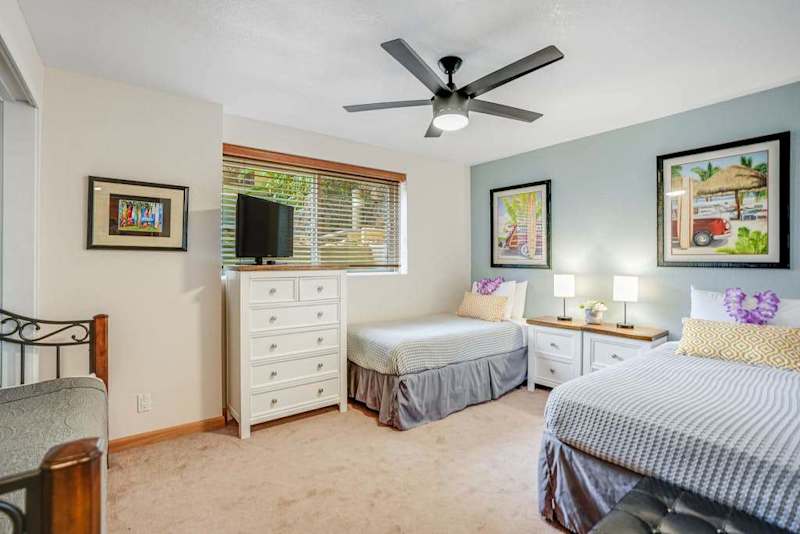 Small television visible from both twin beds