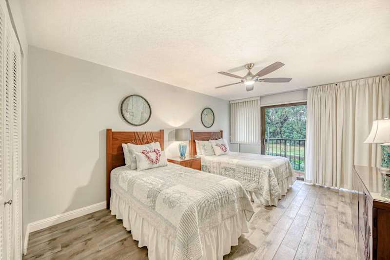 Bright Bedroom With Two Cozy Beds