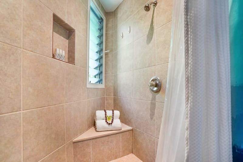 Spacious bathroom with double vanity and ample storage.