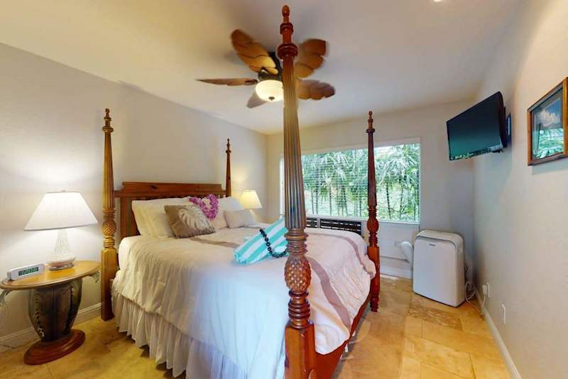Peaceful bedroom presents layered bedding, tasteful accents, and restful surroundings