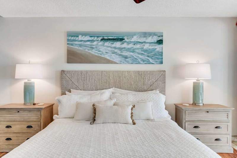 Primary bedroom with a plush headboard, perfect for resting comfortably