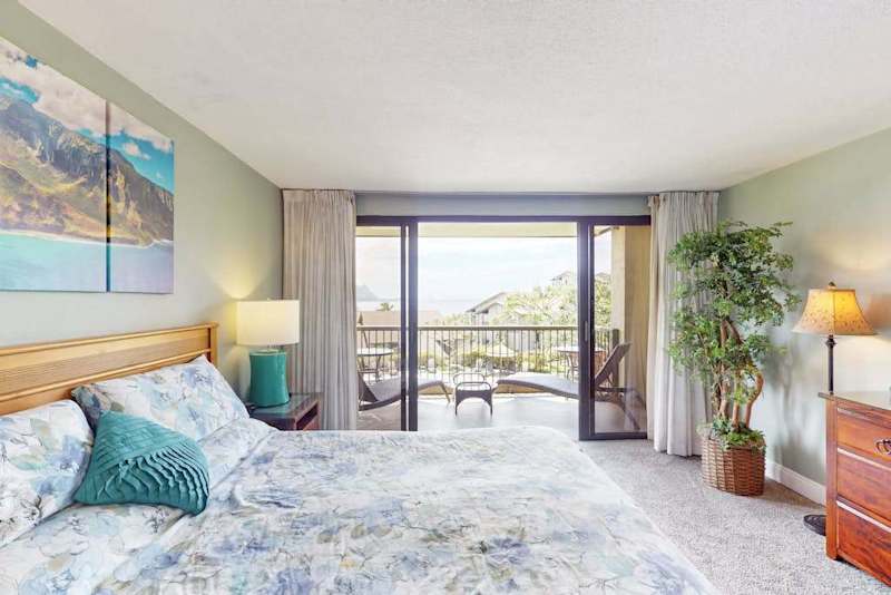 Relax in this bright bedroom overlooking beautiful tropical island scenery